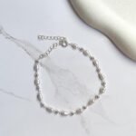 Pulseira bolinhas e pérolas