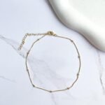 Tornozeleira bolinha ouro 18k