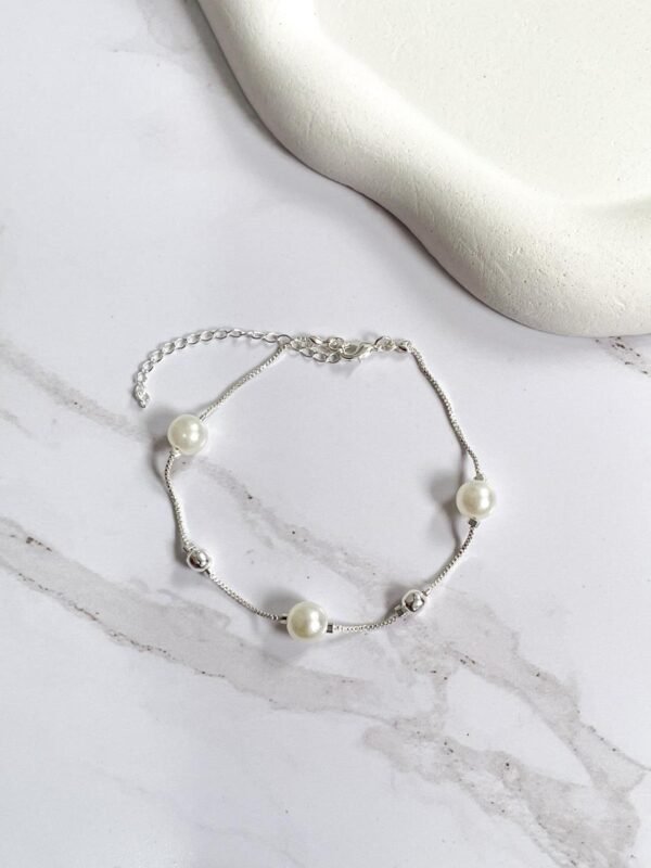 Pulseira pérolas e esferas
