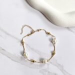 Pulseira pérolas e esferas ouro 18k