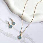 Conjunto trevo azul ouro 18k